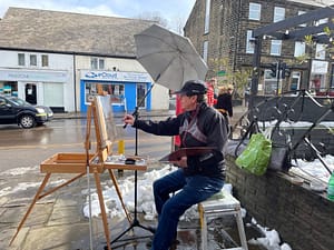 a photo of Alan Taylor painting en plein air in Penistone